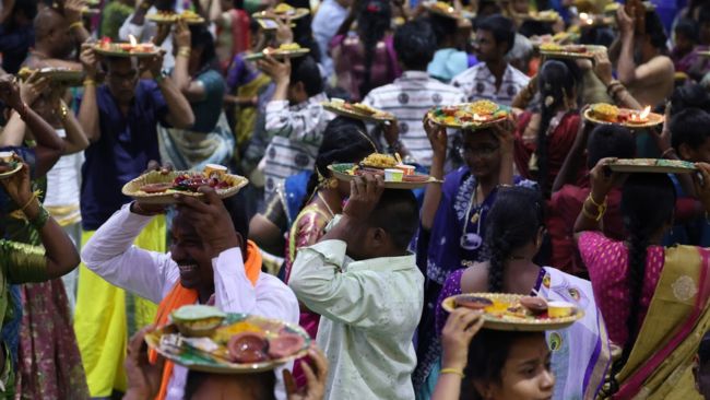 carrying the Padukas onto their hea